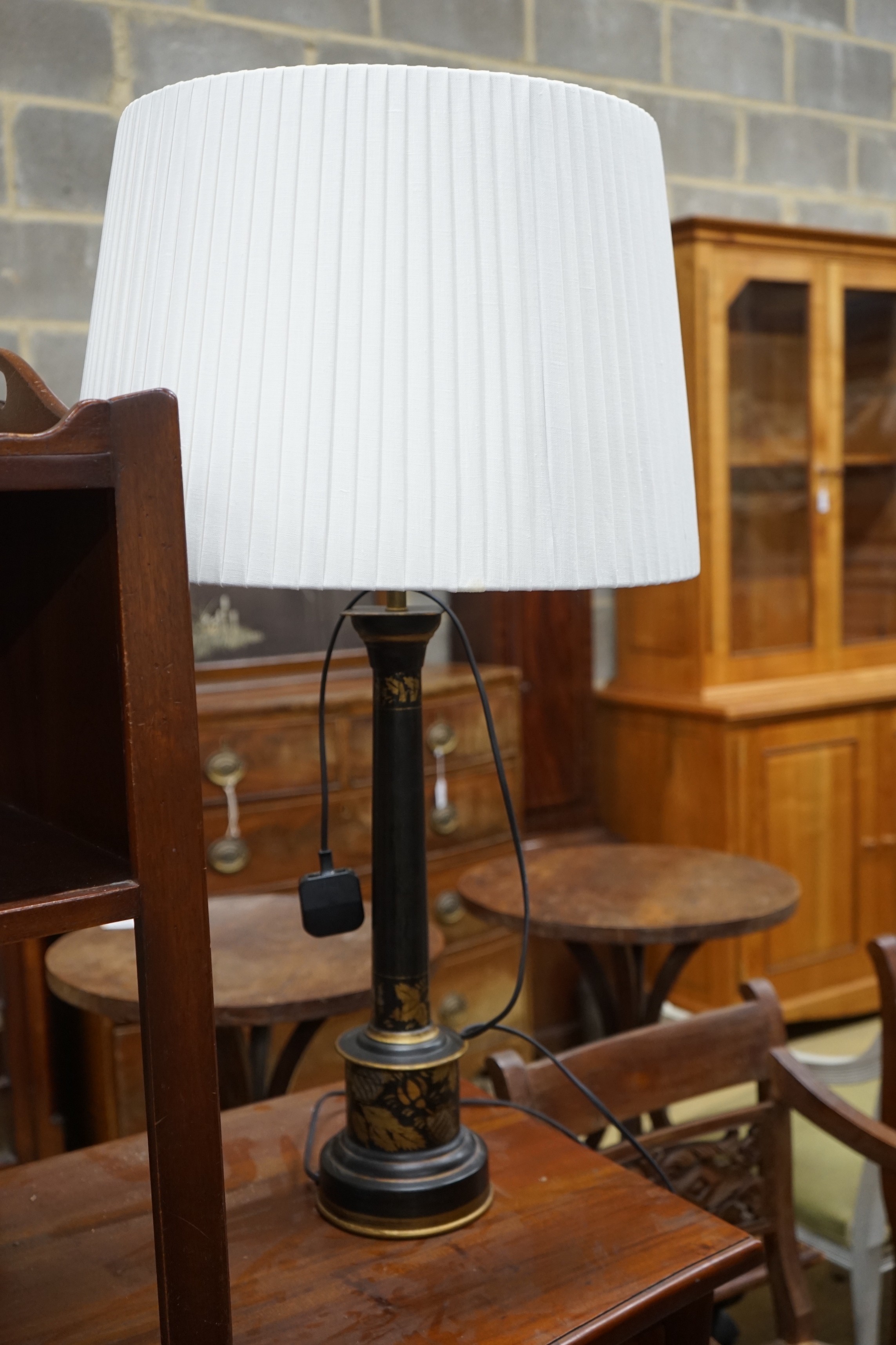 A pair of Oka gilt leaf decorated lacquered table lamps and shades, height including shades 89cm